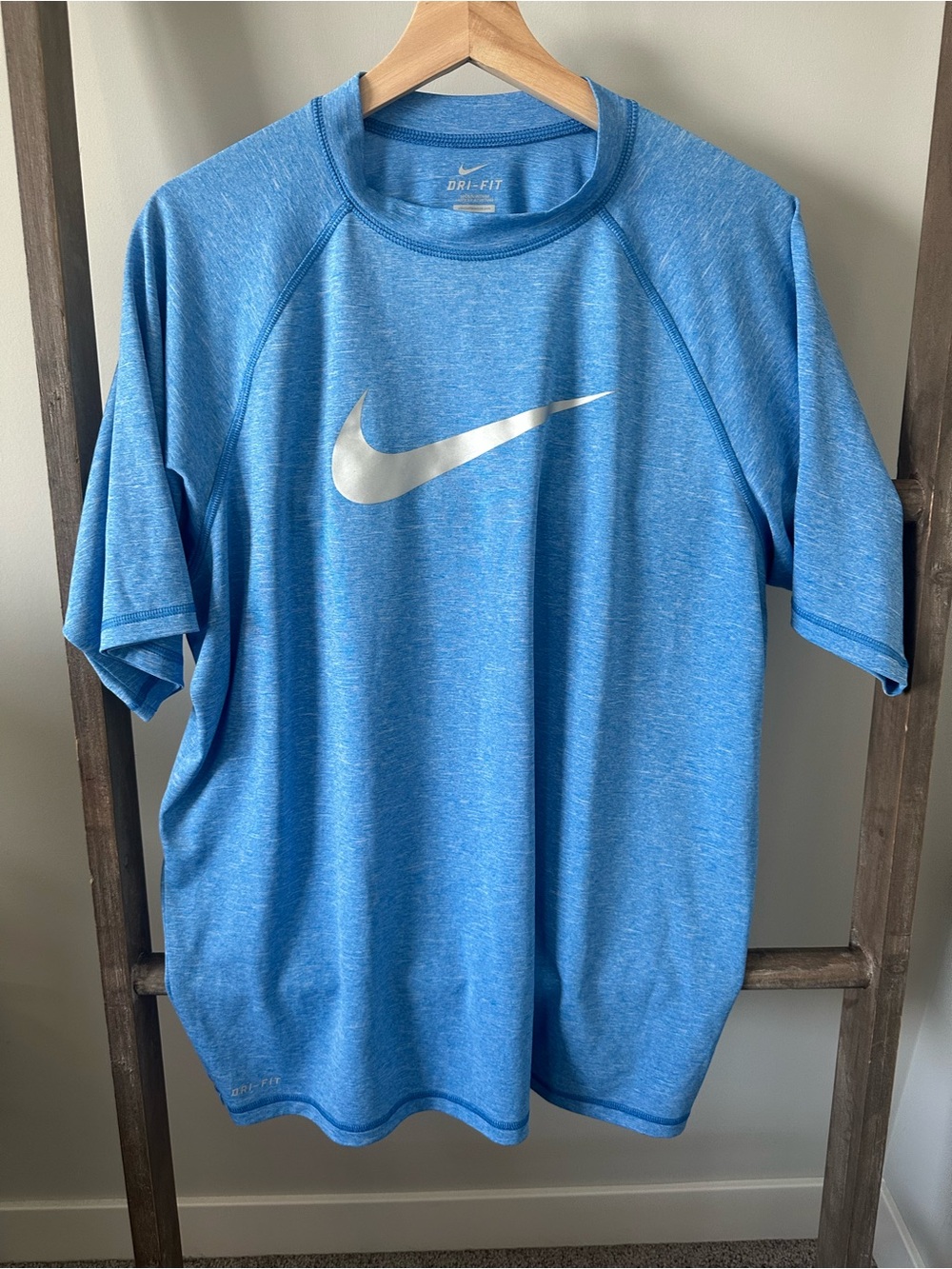Nike Short-Sleeve Heathered Light Blue Athletic Tee with Silver Swoosh